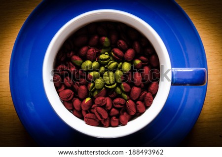 cup with coffee grains. Flag of Vietnam on the coffee. Popularity of coffee in this country is very high. The country is also one of the largest coffee producers