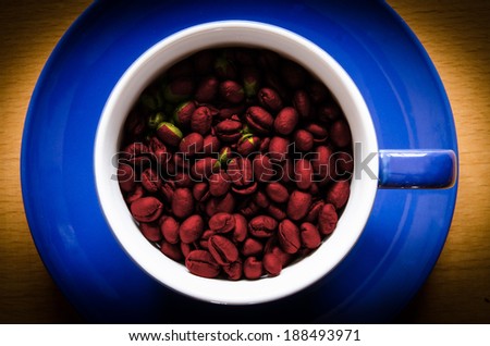 cup with coffee grains. Flag of China on the coffee. Popularity of coffee in this country is very high. The country is also one of the largest coffee producers