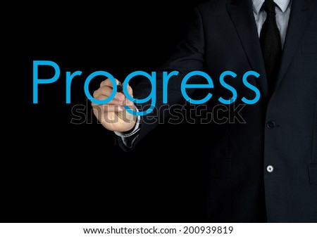 businessman writing progress on black background