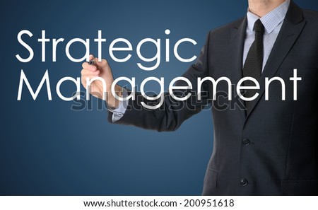businessman writing strategic management