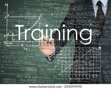 businessman handwriting Training on a transparent board