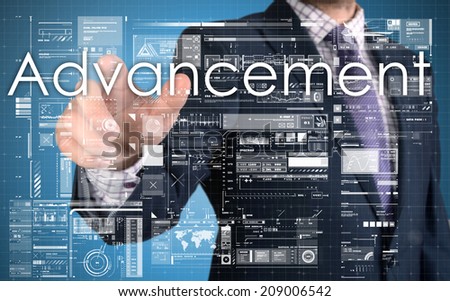 businessman presenting Advancement text on business background
