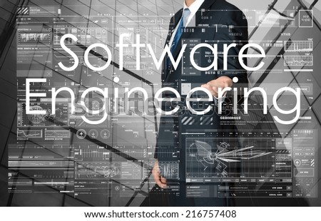 businessman presenting Software Engineering text and graphs and diagrams with skyscraper in background