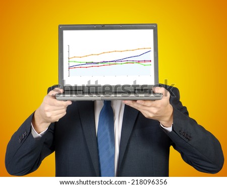 man presents a diagram on the laptop on orange background