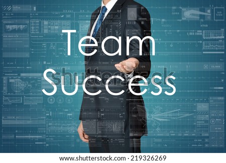 the businessman is presenting the business text with the hand: Team Success