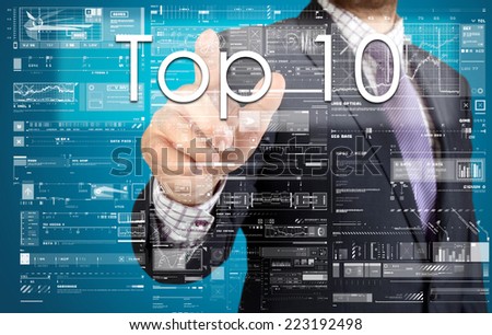 the businessman is pressing the button on the touch screen: Top 10 , business concept describing the modern business