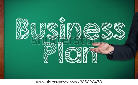 Business Plan with Creative Businessman showing Positive Growth presenting on blackboard by hand