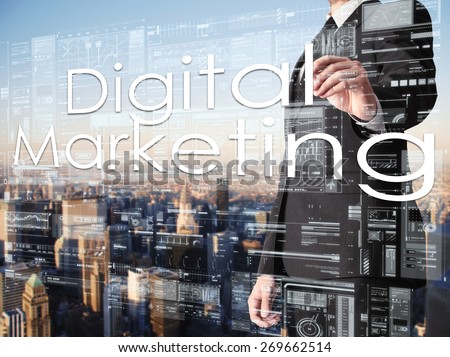 businessman writing Digital Marketing on transparent board with city in background