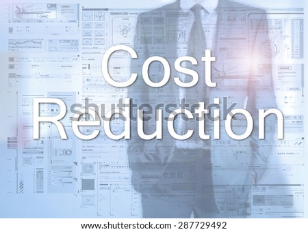Businessman standing behind transparent board with diagrams and text Cost Reduction