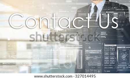 the businessman in the office is writing on the transparent board: Contact Us