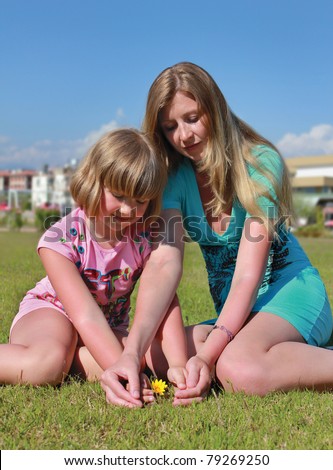 Mom and daughter save flower