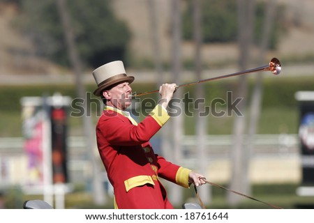 ARCADIA, CA - Feb 9, 2007: Bugler Jay Cohen sounds the call to post at Santa Anita Park. This year on October 24-25, the track hosts the Breeder\'s Cup Classic, the richest two days in sports.
