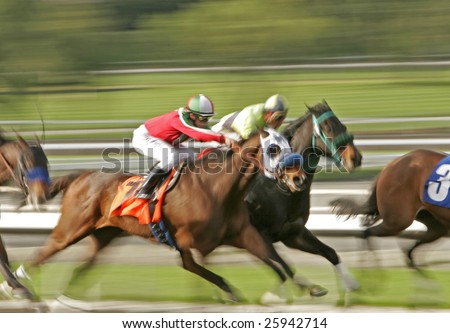 Slow shutter speed rendering of racing jockeys and horses
