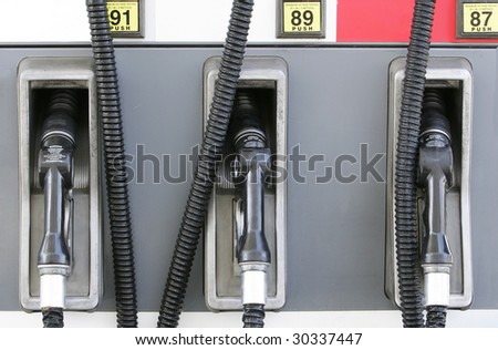 Three gasoline pumps at gasoline station