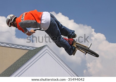 MILFORD, CT - AUG 16: A BMX biker performs high-flying stunts in a show by Eastern Action Sports Team August 16, 2009 in Milford, CT. BMX biking became an Olympic sport last year.