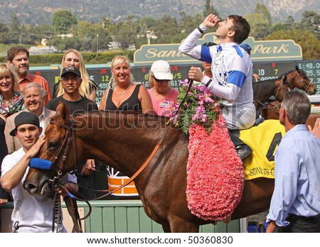 ARCADIA, CA - APR 3: Jockey Joe Talamo raises his fist in victory after winning The Santa Anita Derby aboard Sidney\'s Candy at Santa Anita Park on Apr 3, 2010 in Arcadia, CA.