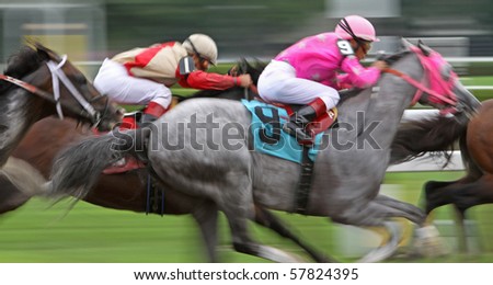 SARATOGA SPRINGS - JUL 25: Jockeys Edgar Prado (#9) and Javier Castellano (#1) compete in an allowance race at Saratoga Race Course on Jul 25, 2010 in Saratoga Springs, NY.