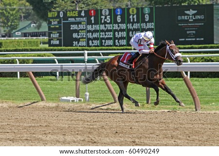 SARATOGA SPRINGS, NY - AUG 27: Jockey Garrett Gomez and Trickmeister win The Pleasant Colony Stakes at Saratoga Race Course on Aug 27, 2010 in Saratoga Springs, NY.