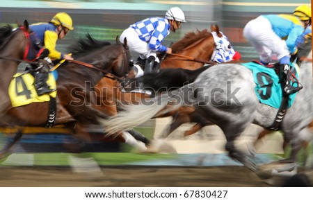 ARCADIA, CA - DEC 26: Skellytown (blue checks), under Victor Espinoza, surges up the inside to win the first race of the 74th Santa Anita Park meet on Dec 26, 2010 in Arcadia, CA.