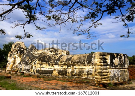 Old statue buddha sleep and cloud at Wat Lokaya Sutha the historic temple, Ayutthaya Thailand.