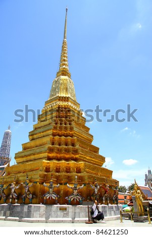 Gold pagoda and photography at Wat Phra Kaew in Bangkok, Thailand.