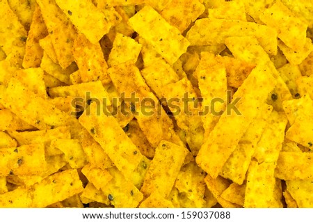 Close up of spicy multi grain corn chip strips for taco salads. Though multigrain, they contain saturated fats so not a healthy salad addition, though tasty!