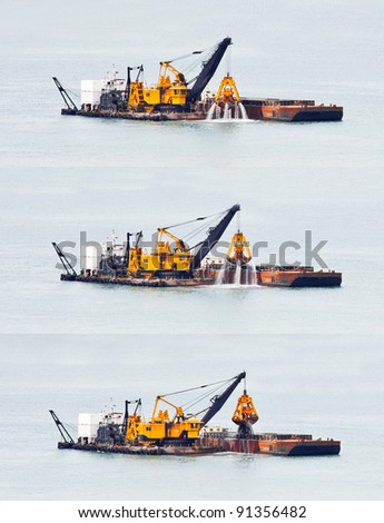 Sand dredging from the South China Sea in Singapore. 3 images at of dredger as it brings up sand from the seabed and prepares to deposit it on a barge.
