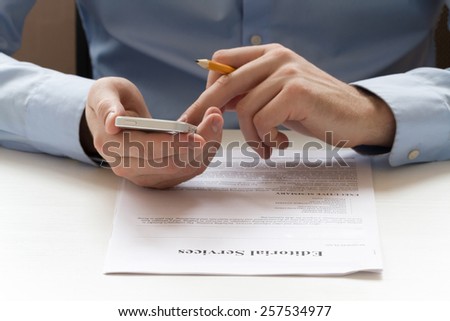 Business concept. Businessmen holding a smartphone, reading and check the documents