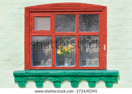 Old painted rustic window with curtains in the house