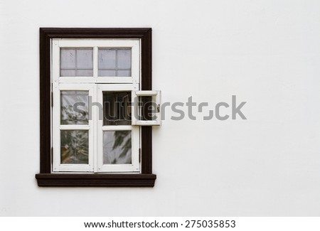 Old vintage wooden window in white wall with place for your text