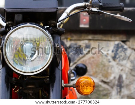 Vintage motorbike concept. Retro motorcycle with headlights on white and red colors