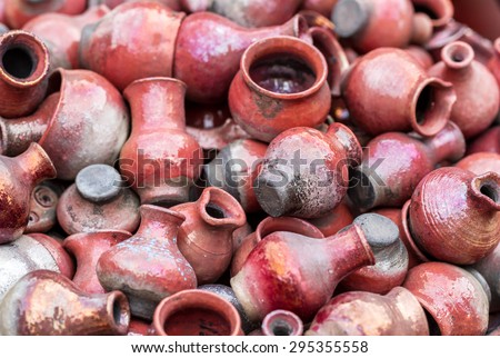 Top view of different red clay pots, jugs and bowl as background