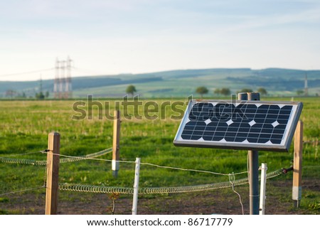 Solar energy panel with electric fence on a farm