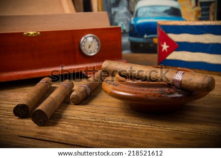 [Obrazek: stock-photo-cuban-cigars-and-humidor-wit...521612.jpg]