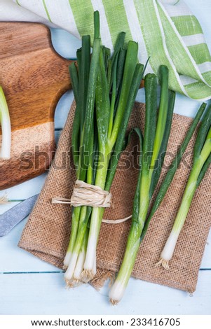 farm fresh spring onion on table