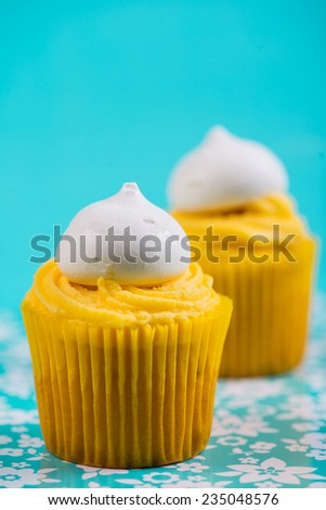 yellow cup cake on blue background