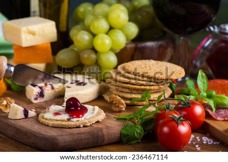Organic oat crackers with cheese basil and red wine