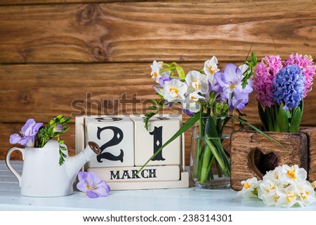 First day of spring vintage calendar and fresh flowers