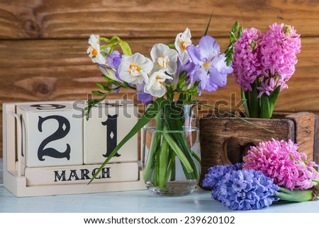 First day of spring vintage calendar and fresh flowers