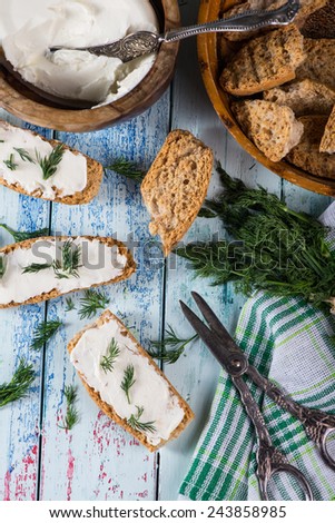 fresh dill with soft white cheese and wholegrain bread