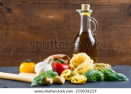 Selection of italian typical food on black background