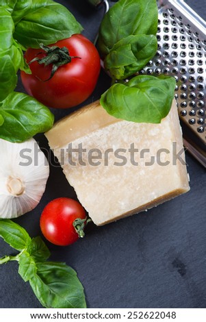 Selection of italian typical food on black background from above