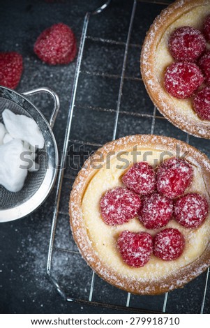 Traditional homemade fresh raspberry tart on cooling tray
