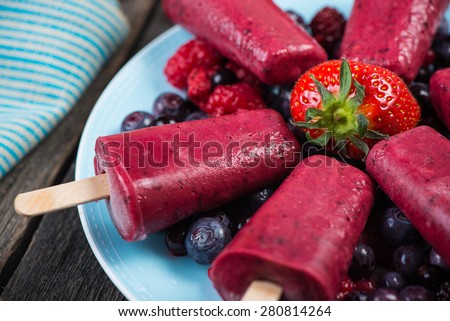 Homemade organic summer fruit ice cream on plate with fresh fruits