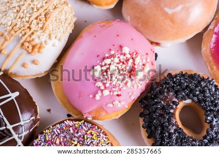 overhead view on vibrant donuts in office brunch box