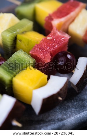 Mixed exotic fruits on skewers, party healthy snack