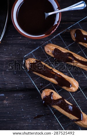 Fresh churro with melting chocolate dip on cooling tray