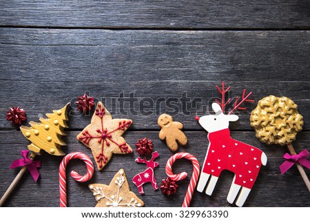 Christmas festive homemade decorated sweets on wooden background