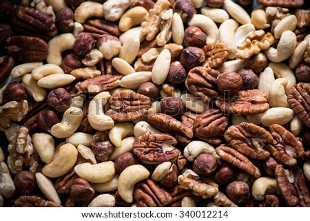 mixed dry nuts, food background from above