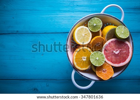 Vibrant citrus half cut fruits on wooden table